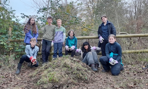 Young people building a hibernaculum